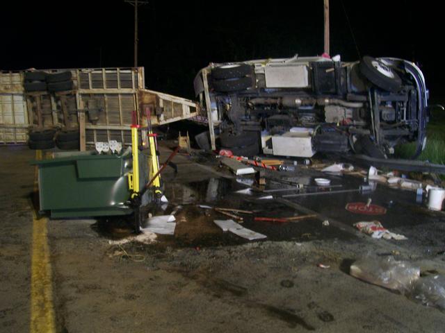 Over view of the leak and overturned vehicle and trailer